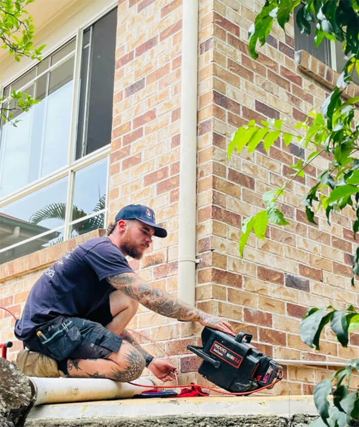 Plumber In Logan Using A Cctv Camera To Inspect A Blocked Drain