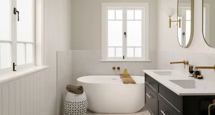 Bathroom renovation with a freestanding bath and brass tapware by Adept Plumbing & Gas