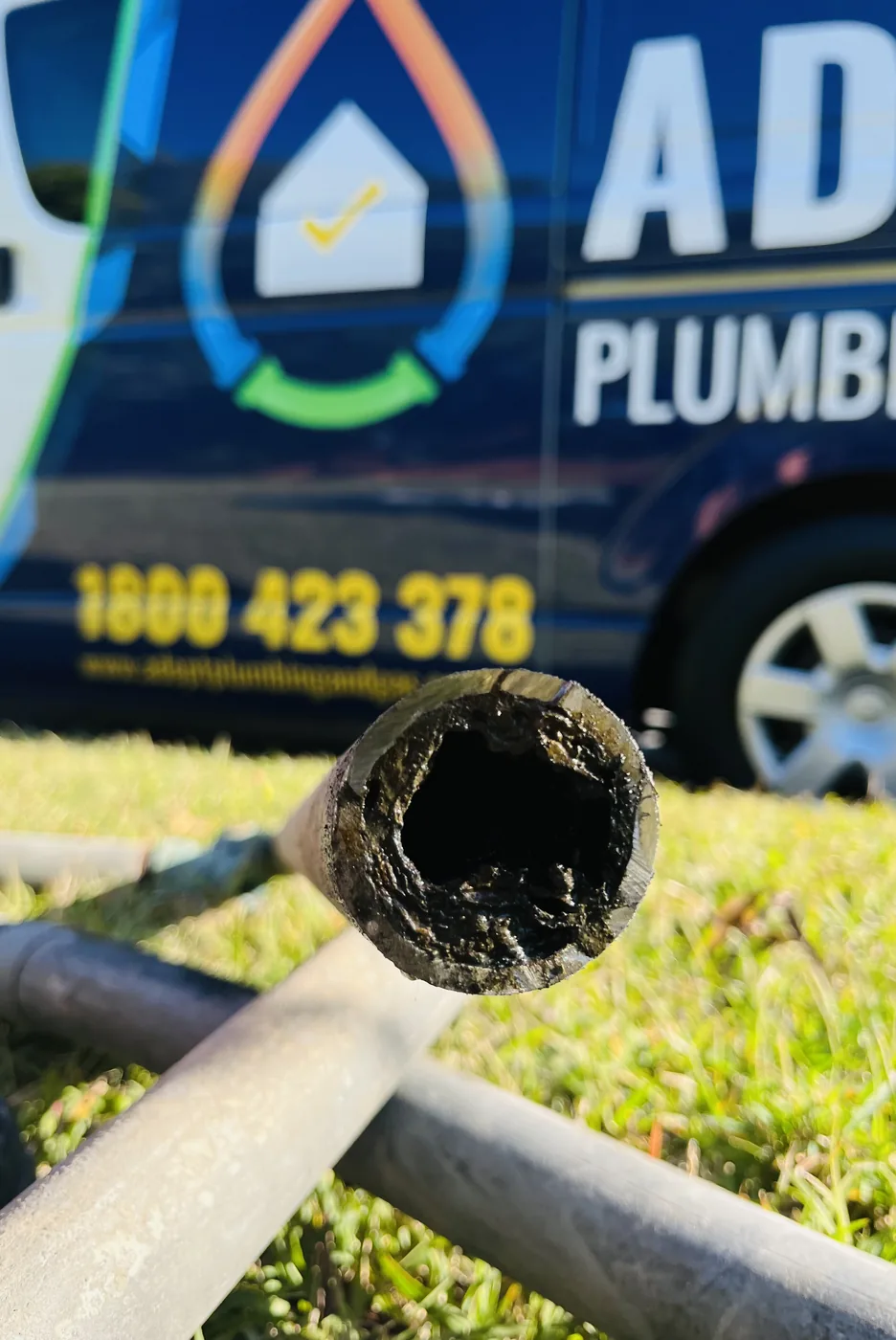 Cut section of blocked pipe in front of an Adept Plumbing & Gas van in Camp Hill