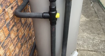 Everhot electric storage hot water system installed beside a brick wall at a Daisy Hill home