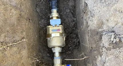 New water meter and pipework in an open trench in Shailer Park