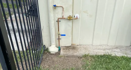 Exterior copper pipework with isolation valves on a Tarragindi home