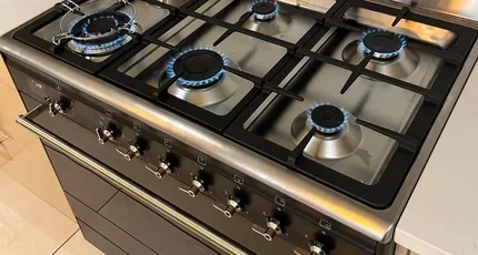 Gas cooktop with the burners lit in a Tarragindi kitchen