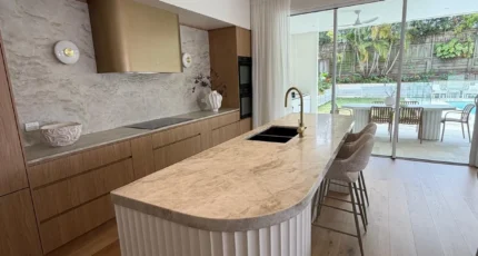 Renovated kitchen with an island bench and mixer tap