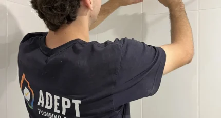 Adept Plumbing & Gas plumber fitting tapware in a bathroom