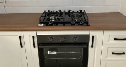Gas cooktop and oven installed in a Beenleigh kitchen