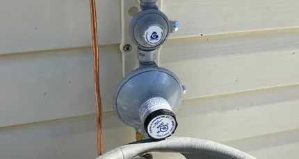 Gas regulator changeover on an LPG bottle in Beenleigh