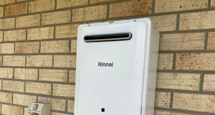Rinnai continuous flow gas hot water unit on a brick wall in Carina