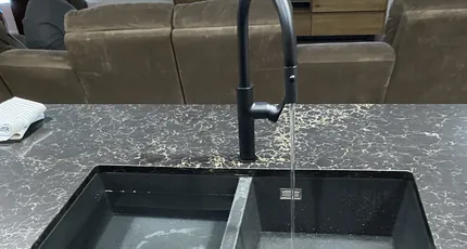 Black pull-out kitchen mixer over a double sink in Cornubia