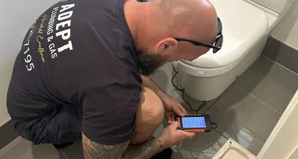 Adept Plumbing & Gas plumber testing a toilet for leaks in Daisy Hill