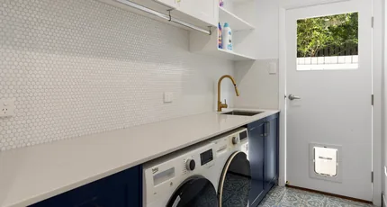 Renovated laundry with plumbed sink and appliances in Greenslopes