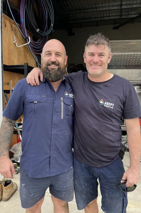 Two Adept Plumbing & Gas plumbers at the service truck, Greenslopes