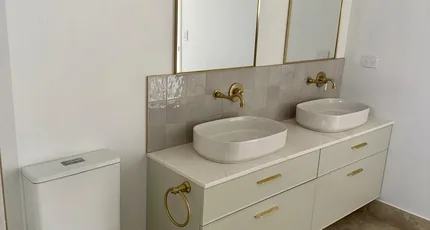 Bathroom with a double vanity and brass tapware in Logan