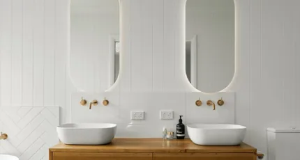 Renovated bathroom with a timber vanity and twin basins in Logan