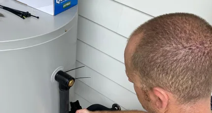 Adept Plumbing & Gas plumber connecting a hot water system in Loganholme
