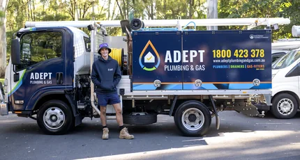 Adept Plumbing & Gas plumber with the service truck in Loganholme