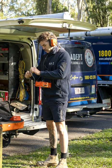 Adept Plumbing & Gas plumber with leak detection equipment at the service van in Loganholme