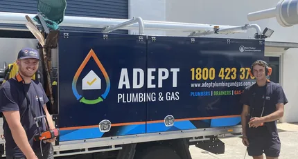 Adept Plumbing & Gas plumbers beside the company truck in Marsden