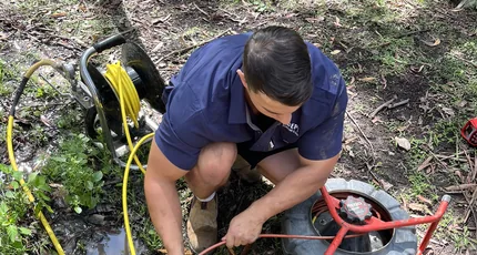Plumber locating an underground drain line in Meadowbrook