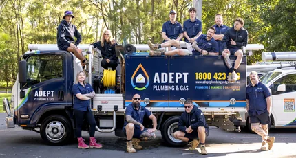 The Adept Plumbing & Gas team with their service truck