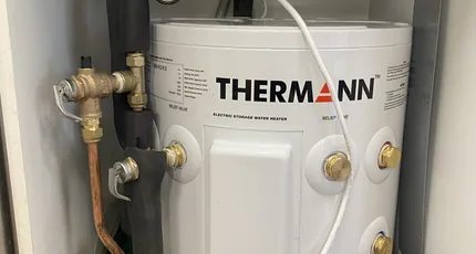 Thermann electric hot water system installed in a New Farm cupboard