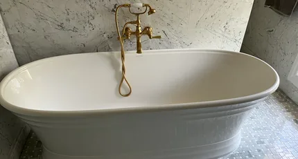 Freestanding bath with a brass bath filler in a Rochedale bathroom