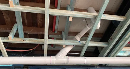 Underfloor drainage pipework under a renovation in Shailer Park