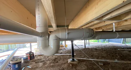 New PVC pipework under a raised house in Shailer Park