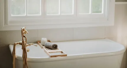 Clawfoot bath with brass tapware in Springwood