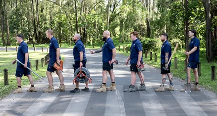 The Adept Plumbing & Gas team crossing the road with their tools in Waterford