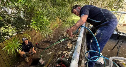 Adept Plumbing & Gas plumbers repairing a drain in a West End garden