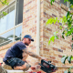 Plumber in Logan using a CCTV camera to inspect a blocked drain