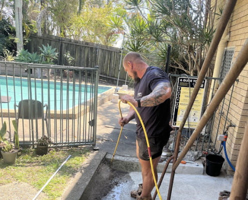 Plumber Logan using a CCTV drain camera to inspect the sewer drain
