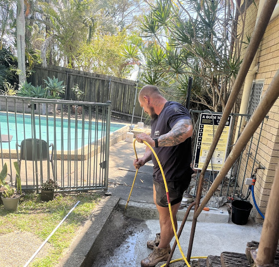 Blocked Drains Plumber Logan using a CCTV drain camera to inspect the sewer drain