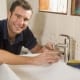 Plumbers heading to Meadowbrook, Shailer Park, Daisy Hill, and Coorparoo fixing sinks with a smile
