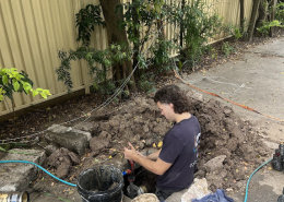 Your Local Emergency plumber at Adept repairing leaking pipes in Logan home