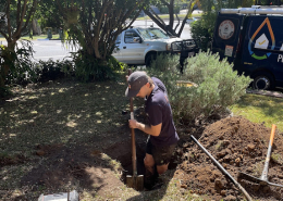 Adept Plumbing & Gas plumber working on an urgent plumbing repair in Logan