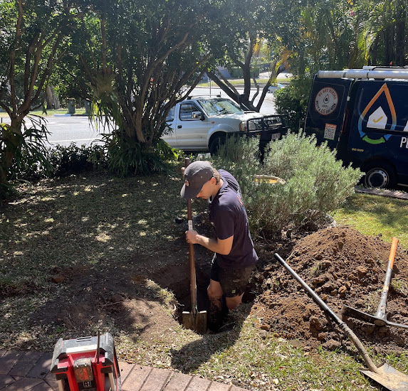 Adept Plumbing & Gas plumber working on an urgent plumbing repair in Logan